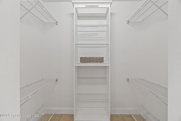 Walk in primary bedroom closet