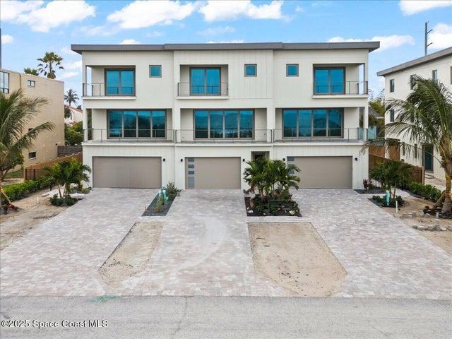 3 story, 4 bedrooms, 4 baths, 3 living rooms, 2 laundry rooms, private elevator + garage