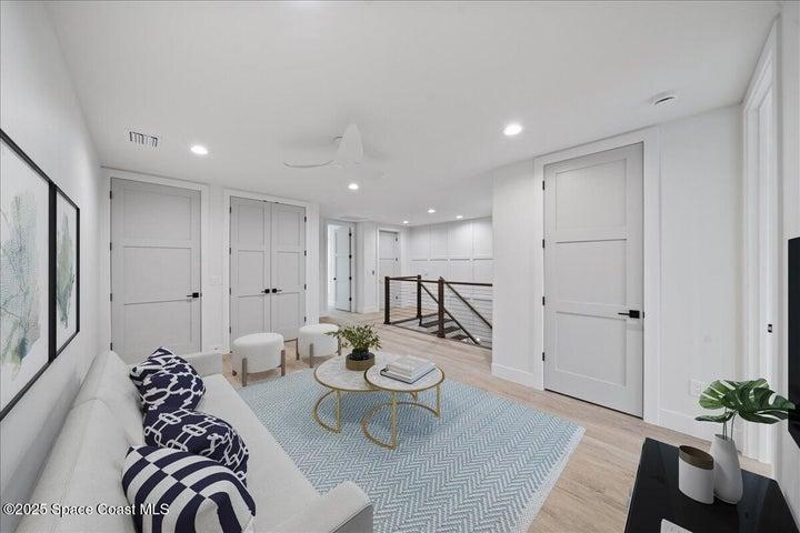 3rd floor living room - laundry room area behind the door on the left.