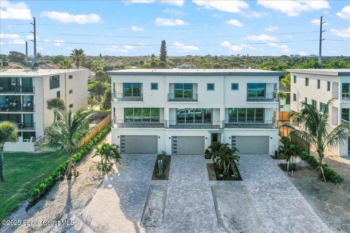 3 story, 4 bedrooms, 4 baths, 3 living rooms, 2 laundry rooms, private elevator + garage