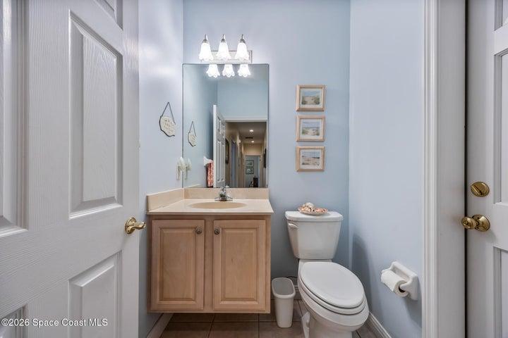 Half Bath with access to covered screened porch