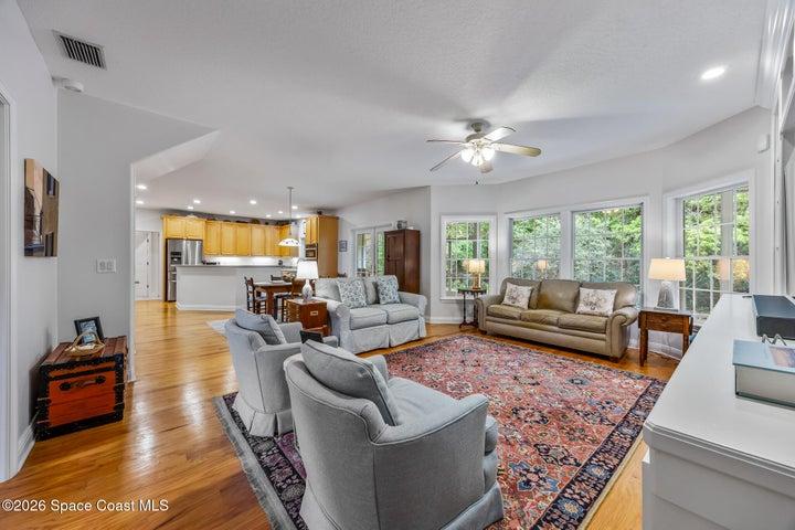 Living room opens to casual eat in area