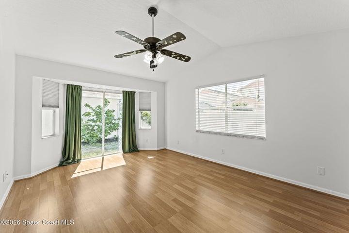 downstairs bedroom with slider to backyard
