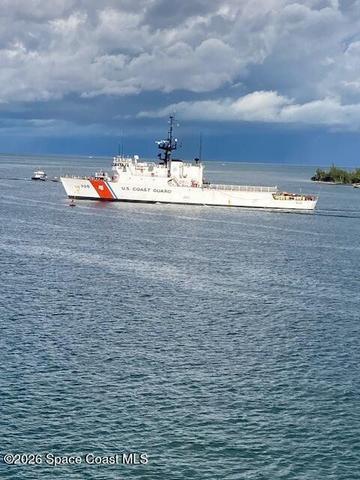 Coast guard passing by in the ocean right out from your balcony.