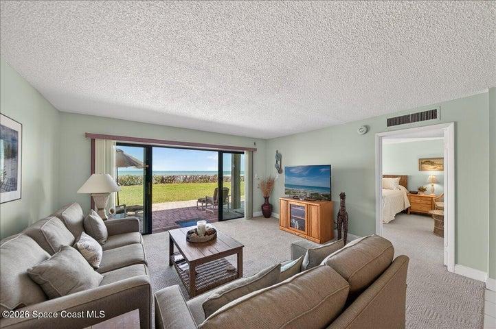 living room / entrance to primary