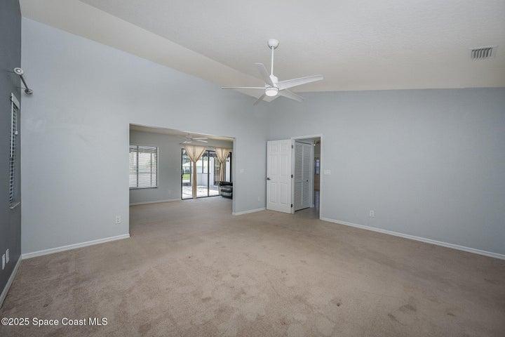 Primary bedroom looking into opposite view of private sitting room