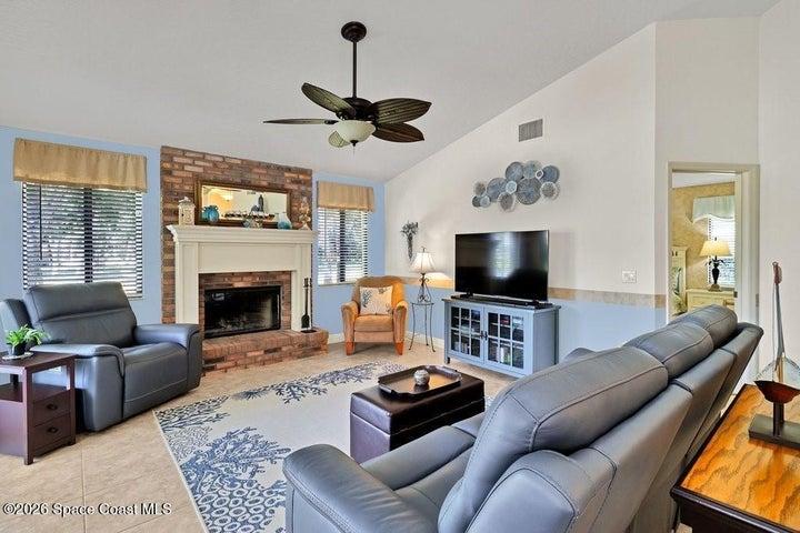 Neutral tile flooring flows throughout the main living areas, completed by soft coastal tones of light blue. Large windows and sliding glass doors open to the glass/screened/covered patio/sunroom seamlessly blending indoor and outdoor living....