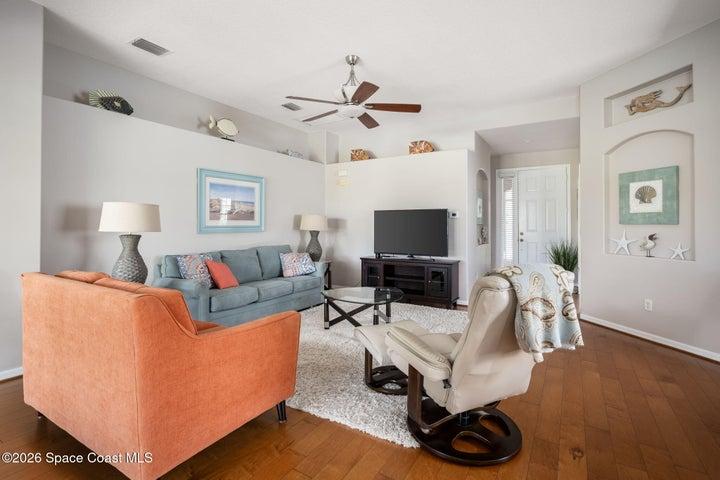 Additional view of living room offers view of front entry
