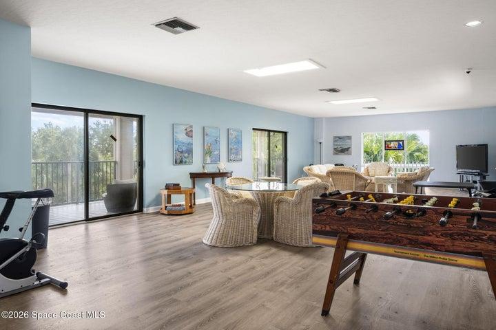 Second floor of community room overlooking pool