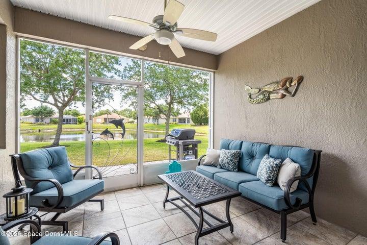 Inviting backyard screened porch perfect for entertaining