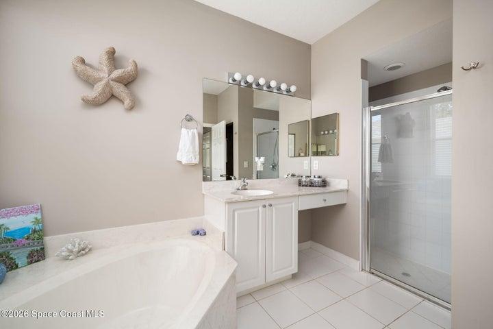 Master Bathroom features separate sinks, walk-in shower and soaking tub