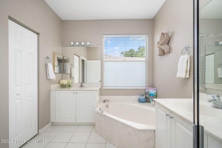 Additional view of master bathroom displays separate sink and large soaking tub