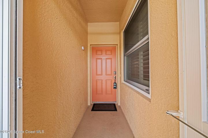 Enclosed front entry into condo.