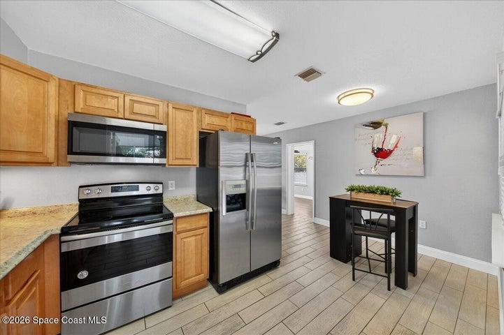 Wood look tile in all main living spaces