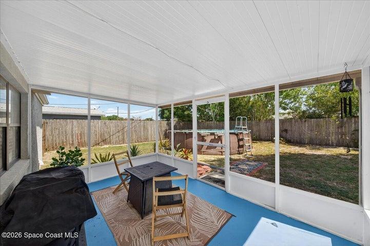 Covered and screened Patio and above ground pool.