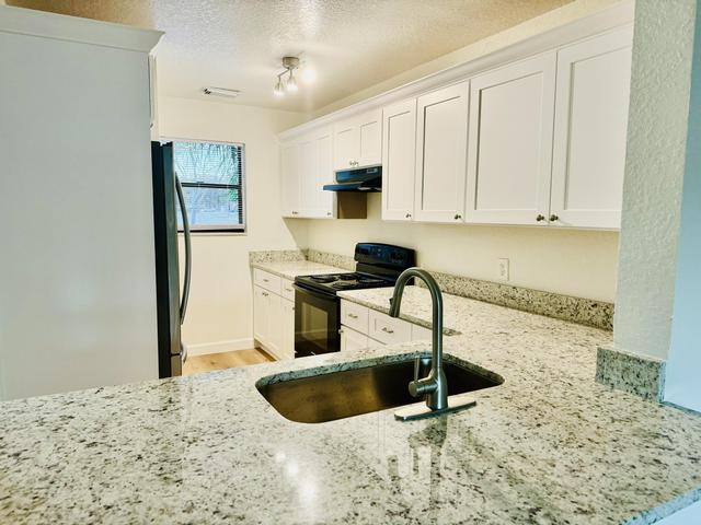 View of kitchen form dining room