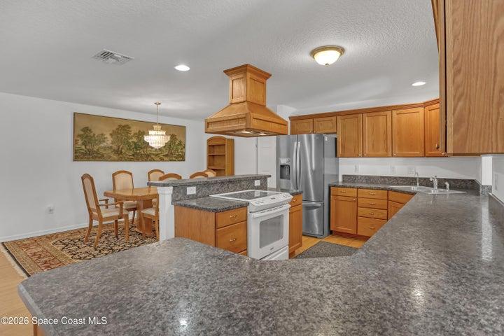 Wooden cabinets, spacious counters.