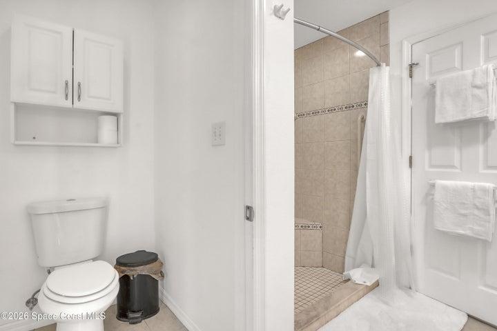 Separate toilet with door in main bath.