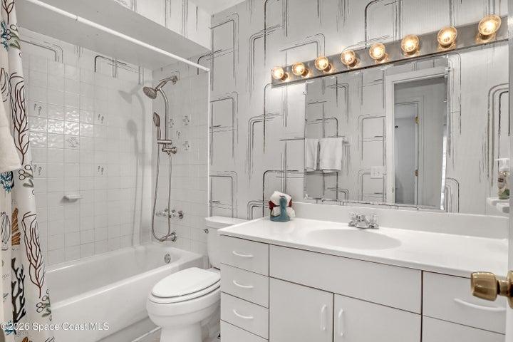 Guest bathroom with tub.