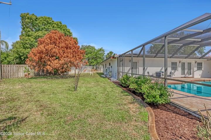 Lots of yard space with mature flowering and fruit bearing shade trees.
