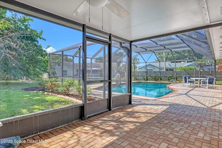 Elegant pavers cover pool deck.