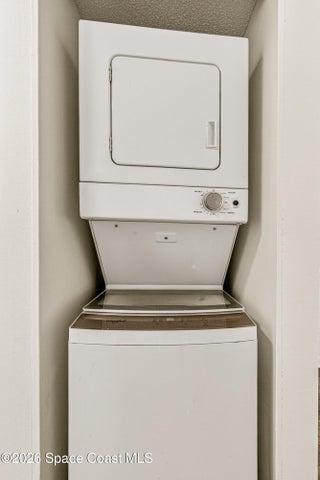 Stacked washer and dryer in each unit