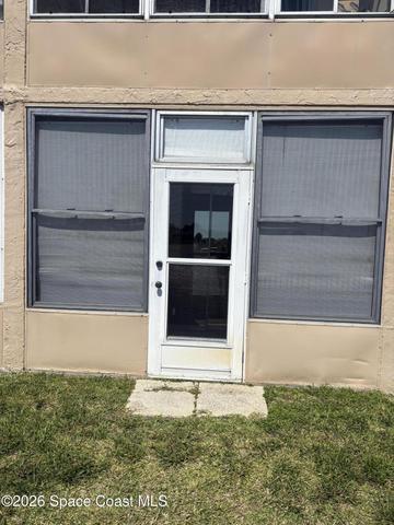 Glass enclosed rear porch overlooks river