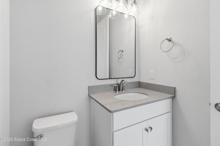 Guest half bathroom located off the formal living/dining rooms