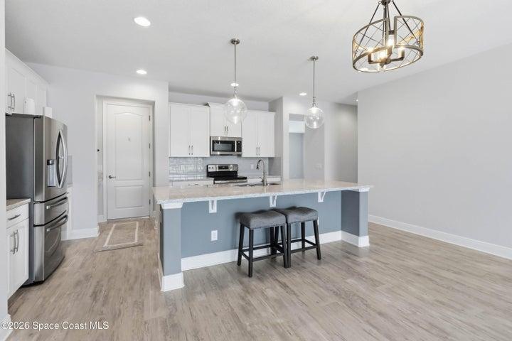 Just off the kitchen is the door leading to a 3-car garage