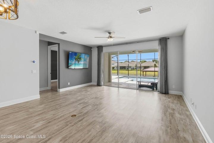 Family room with view of the pool and water