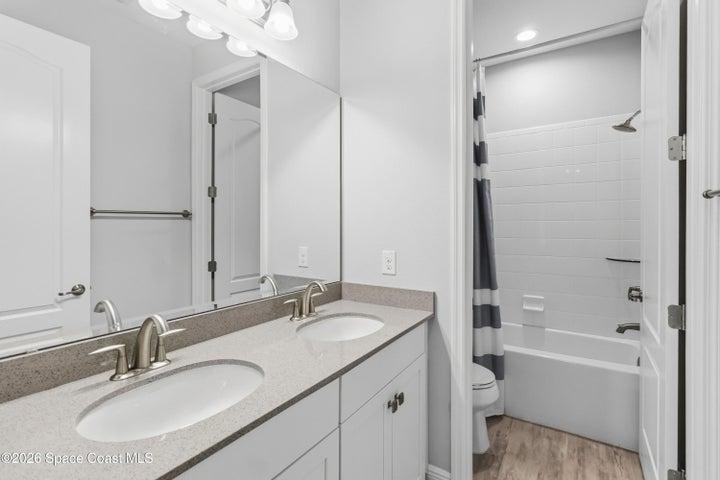 Bathroom 2 with dual sink, quartz vanity top, separate shower room