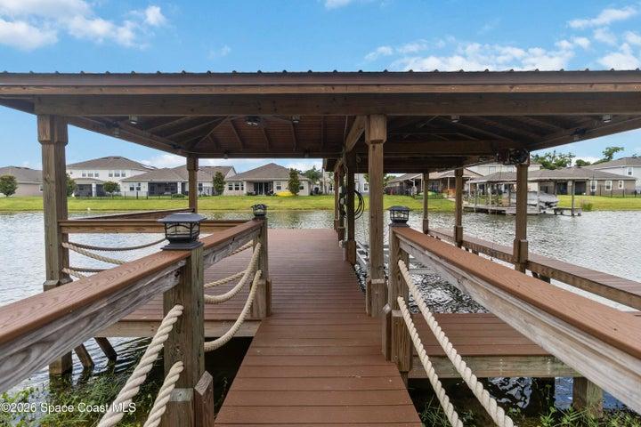 Private covered boat dock with lift, water an electricity