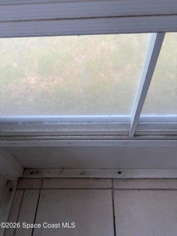Pull up vinyl windows to make porch a Florida Room