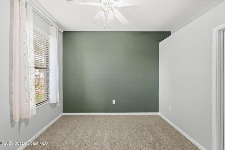 large guest bedroom in the back of the home