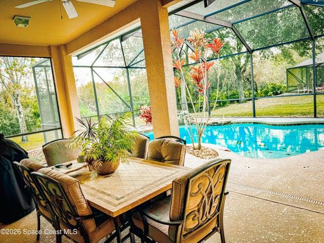 Outdoor living, extended trusses, Preserve view, heated pool.