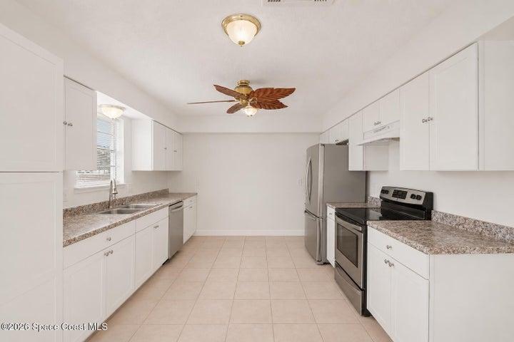 Abundant Counter Space and Cabinetry. Tile Flooring Throughout