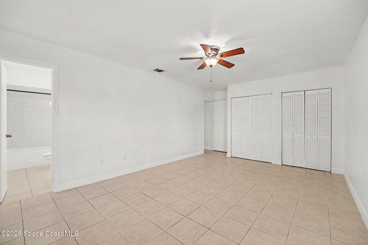 Oversized Primary Bedroom with Ceiling Fan and Spacious Closet