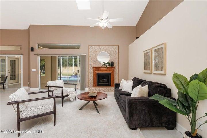 Step thru sliders from the family room to the screened lanai and pool