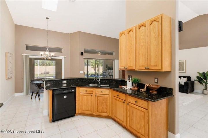 Cook has an excellent view of the pool and family room
