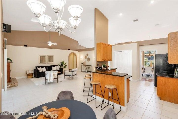 Kitchen opens to breakfast bar and family room