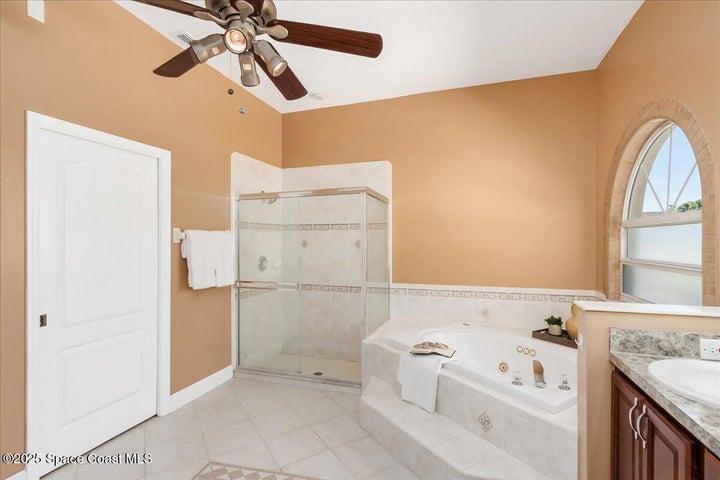 Primary Bath is spa like with jacuzzi tub and stepin in shower