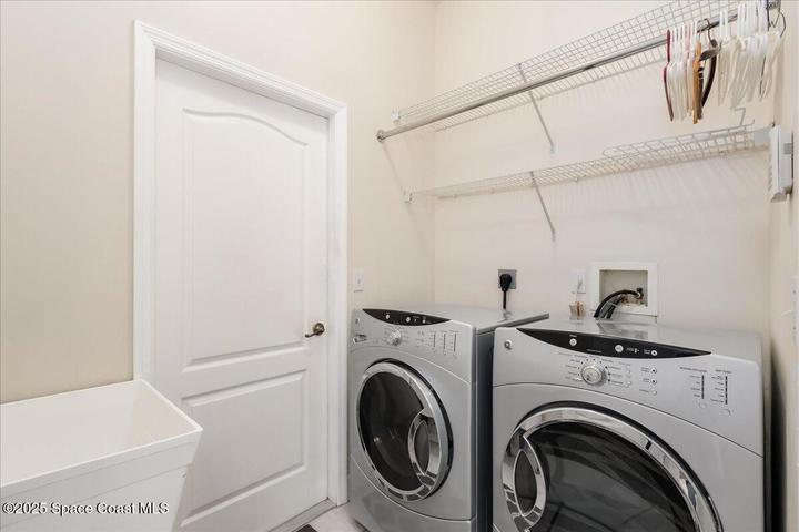 Laundry Room with sink , washer and dryer convey