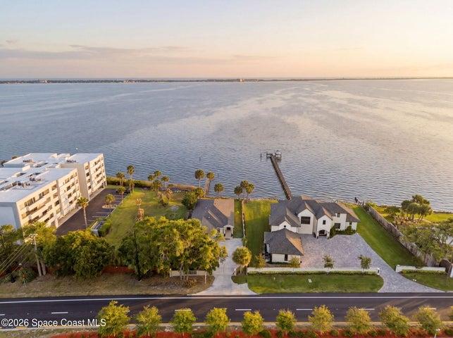 Aerial view of river behind home