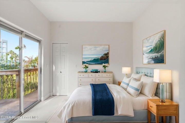 Bedroom #3 with Sliders to balcony and peak views of river. Virtually staged. 2 closets in this room