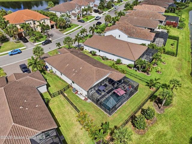 Aerial view showcasing the home’s position within a beautiful community