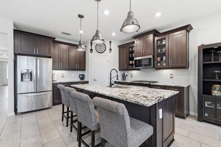 Well-appointed kitchen with ample cabinetry and counter space