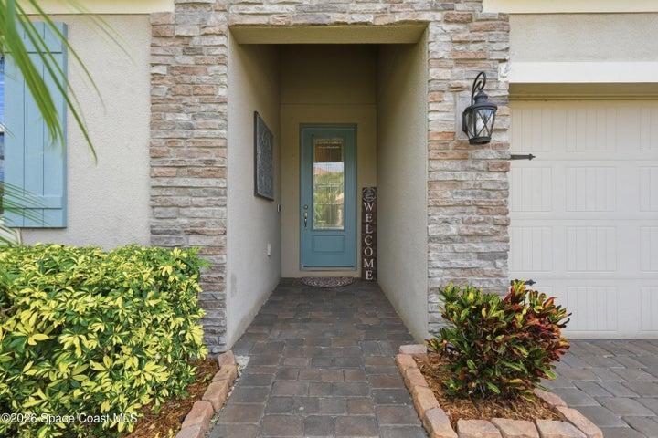 Covered front entry creating a warm and inviting first impression