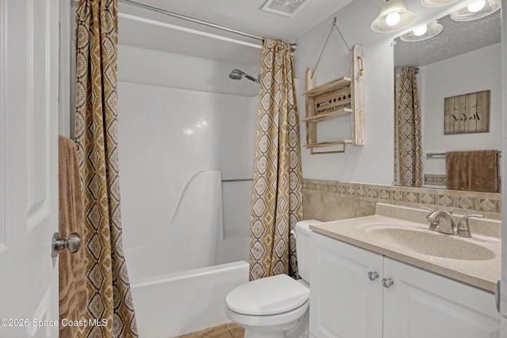 hall bathroom has a tub