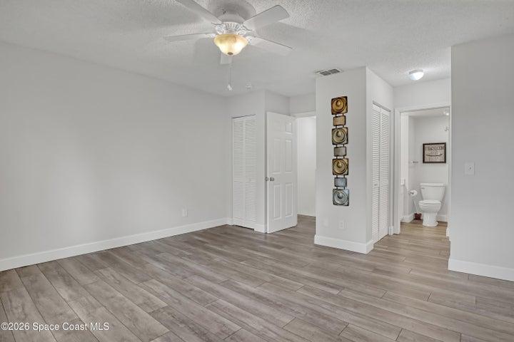 primary bedroom with private bathroom