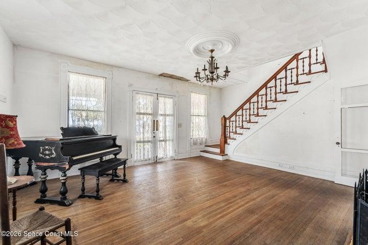 Staircase leading to second floor bedrooms and east wing